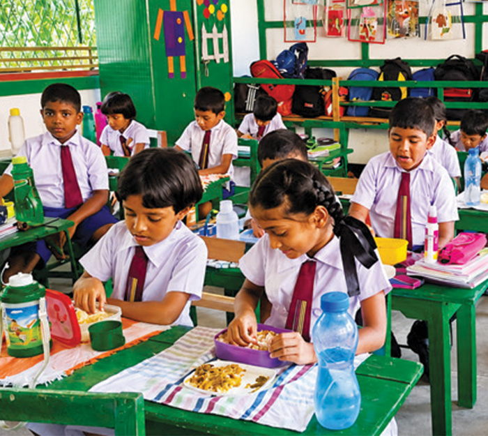 Schoolchildren receiving a mid-day meal